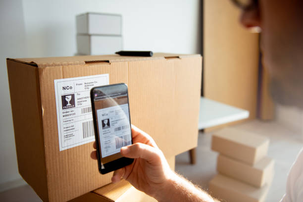 istock Delivery service, scanning a shipping label 1193078270