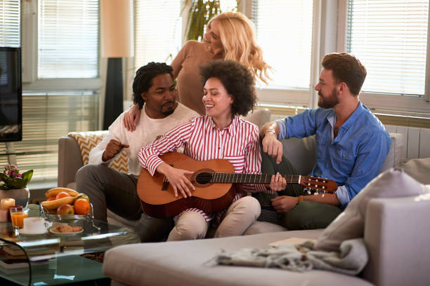 istock Friends enjoys at home with guitar 1193078273