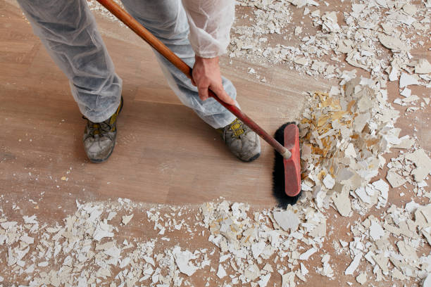 Builder sweeping the floor after renovation Builder sweeping the floor after renovation manual worker house work tool equipment stock pictures, royalty-free photos & images