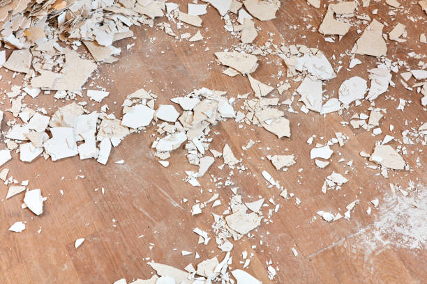 istock Stripped old plaster lying on a wooden floor 1193079660