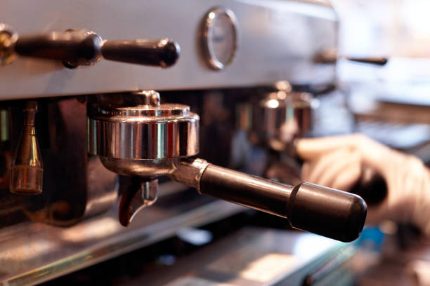 istock Making coffee in a professional coffee machine in a coffee shop 1193079673