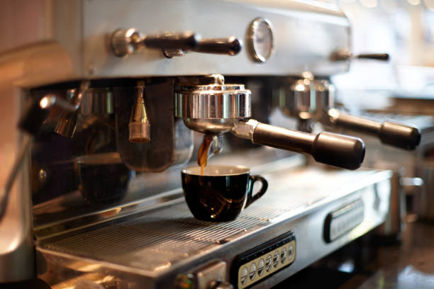 istock Making coffee in a professional coffee machine in a coffee shop 1193079694