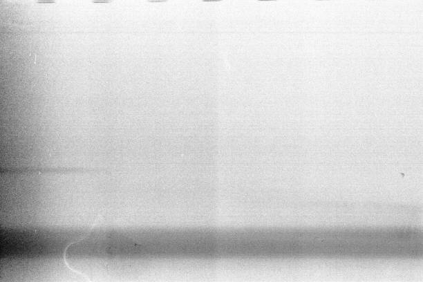 istock Overexposed noisy film frame with heavy noise, dust and grain 1193083221