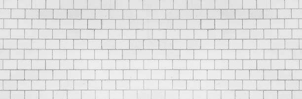 istock White concrete block wall texture background for interior decoration. 1193087449