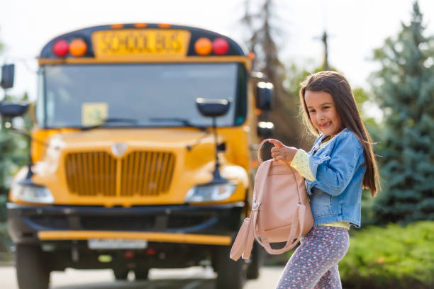 istock little girl with backpack goes to school bus 1193090285
