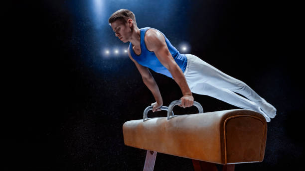 istock Young man performing on pommel horse 1193091694