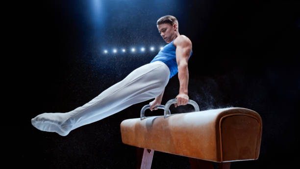 istock Young man performing on pommel horse 1193091703