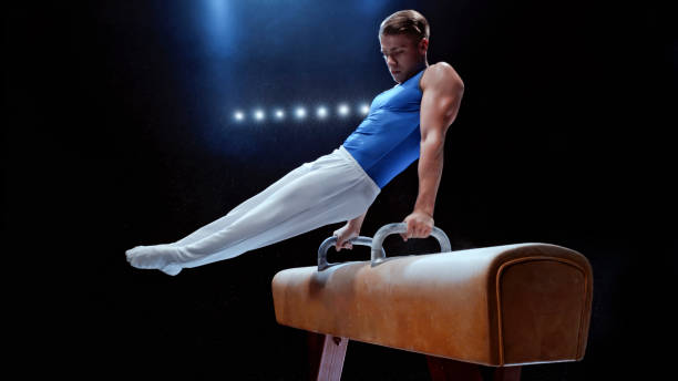 Young man performing on pommel horse