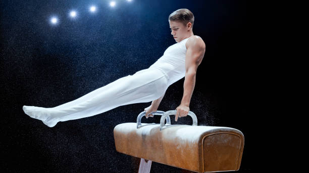 istock Young man performing on pommel horse 1193091708