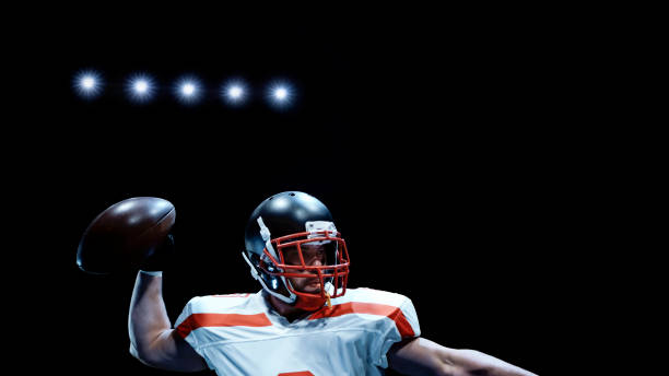istock American football player throwing ball 1193091710