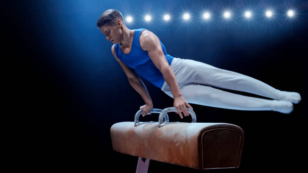 istock Young man performing on pommel horse 1193091711