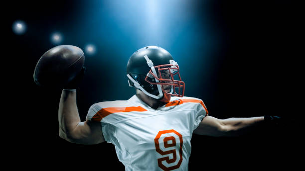 istock American football player throwing ball 1193091717