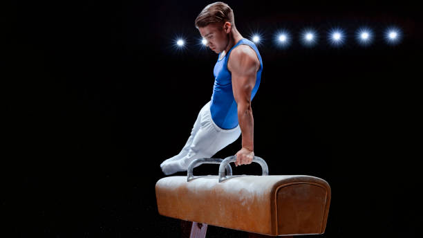 istock Young man performing on pommel horse 1193091721