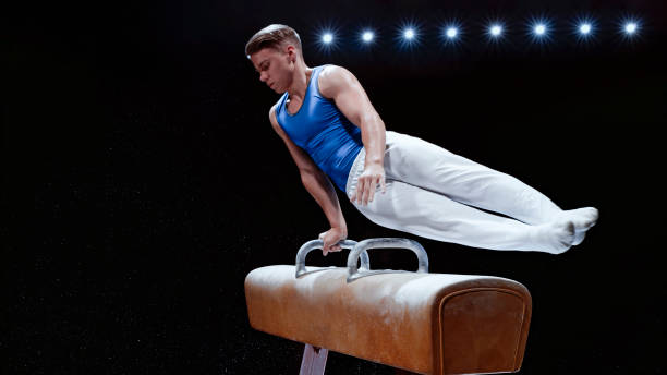 istock Young man performing on pommel horse 1193091722