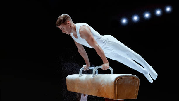 istock Young man performing on pommel horse 1193091724