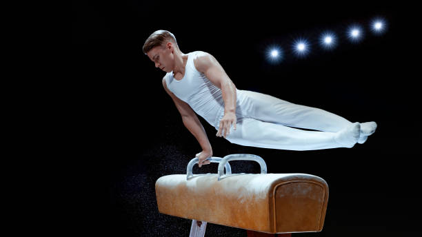 istock Young man performing on pommel horse 1193091727