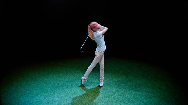 istock Young woman playing golf 1193091760
