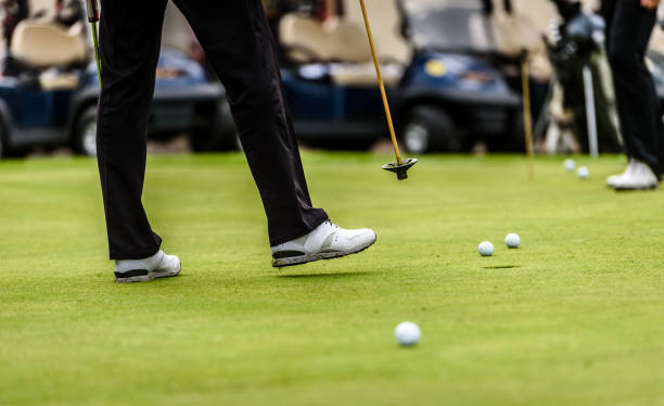 istock Golfer legs at golf tournament practice swing with golf club. 1193091966
