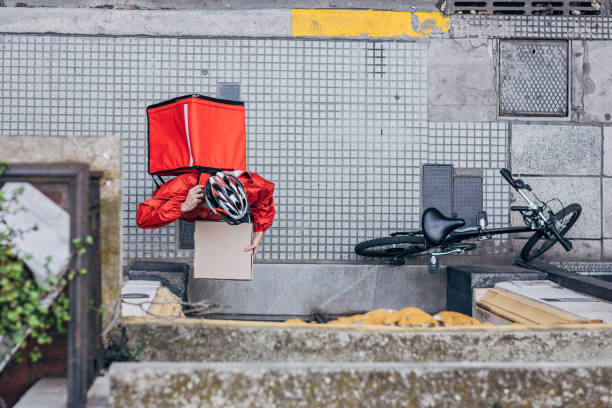istock Guy delivering pizza in city 1193092101