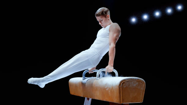 istock Young man performing on pommel horse 1193092122