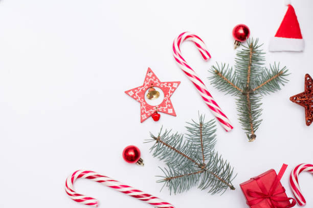 istock Christmas background with copyspace, candy and new year red decor on white background 1193093661