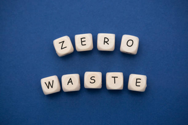 zero waste letter, word cubes over blue background. environment abstract concept. - organic single word environment block imagens e fotografias de stock