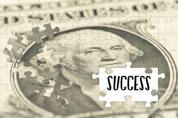 istock Puzzle of dollar banknotes and success 1193097190