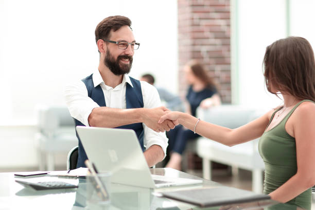 istock handshake of a Manager and a customer at the Desk 1193100922