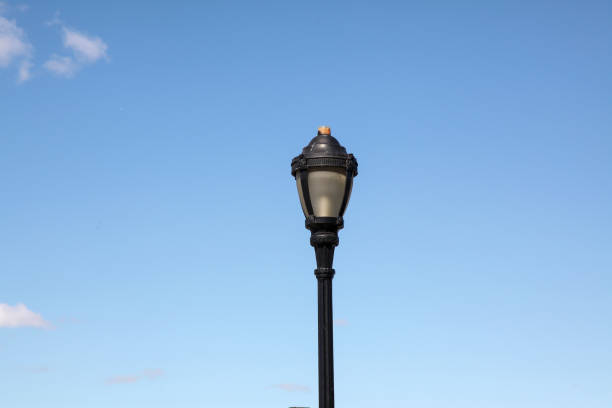 istock Vintage Light pole in blue sky background 1193103593