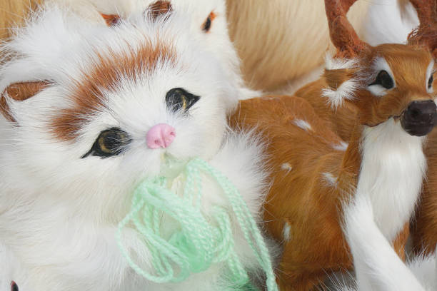 istock Soft toys kittens sitting in front of camera 1193104178