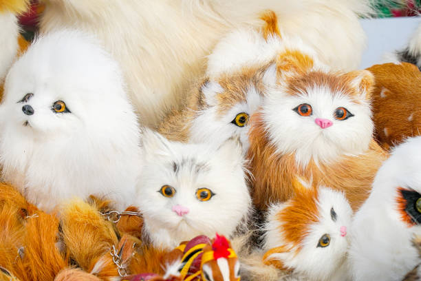 istock Soft toys kittens sitting in front of camera 1193104187