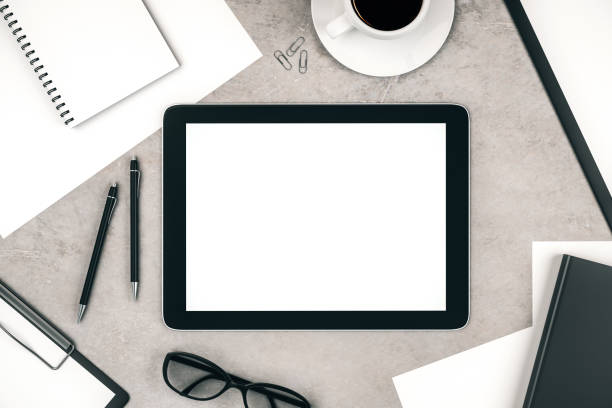 istock Topview of desktop with white tablet 1193104606