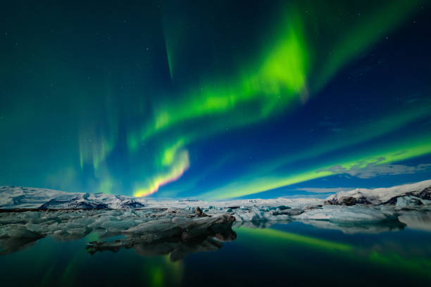 istock Aurora Borealis over a glacier lagoon in Iceland 1193105177
