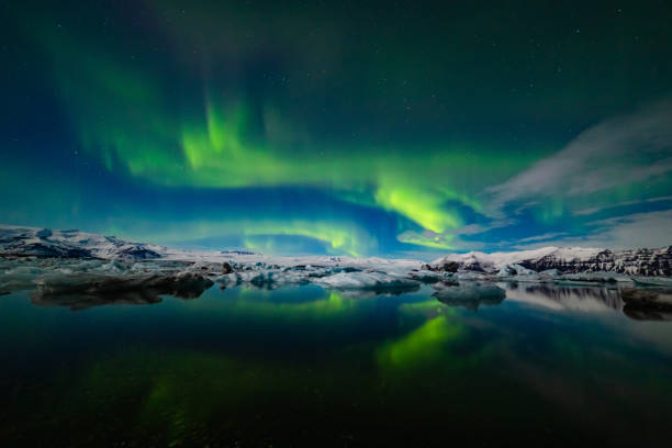 istock Aurora Borealis over a glacier lagoon in Iceland 1193106301
