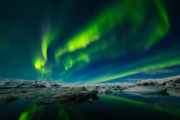 istock Aurora Borealis over a glacier lagoon in Iceland 1193107098