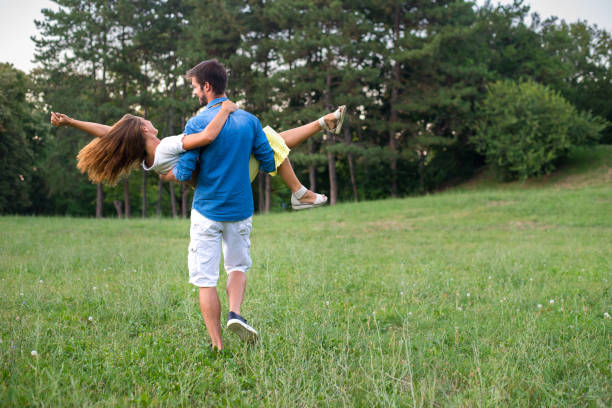 istock Young couple having fun in the summer nature 1193108264