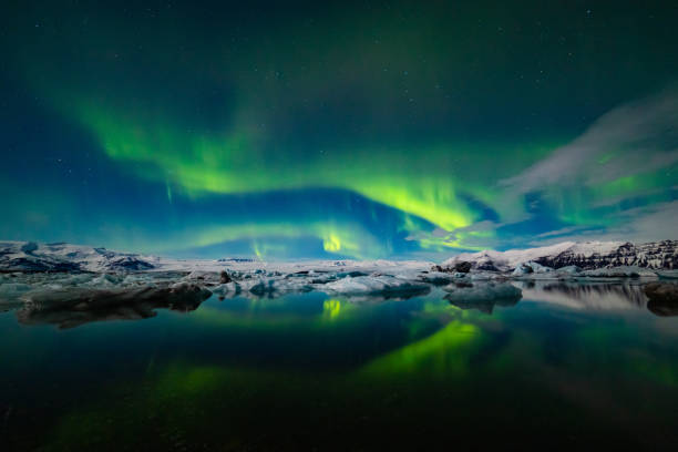 istock Aurora Borealis over a glacier lagoon in Iceland 1193108332