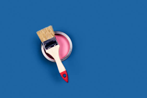 istock Blue background with paint jar and brush. 1193108469