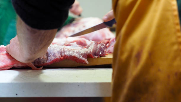 istock Local butcher preparing row meat 1193113981