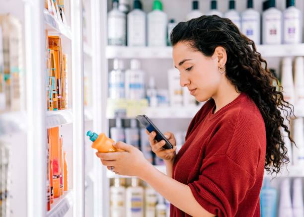 istock Customer using cellphone to scan beauty product 1193114311