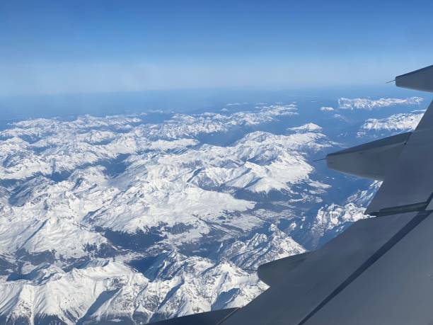 istock Airplane wing over European Alps 1193114346