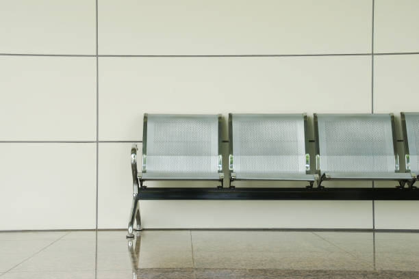 istock Modern Metal Chairs Against White Wall in Waiting Area 1193116754
