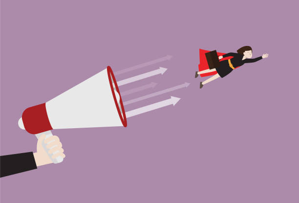 istock Businesswoman with a red cape flying from a megaphone 1193117309