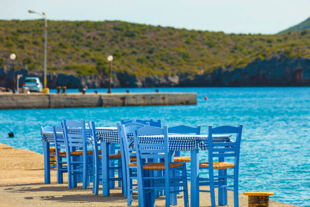 istock Open cafe outdoor restaurant in Greece on sea shore 1193119072