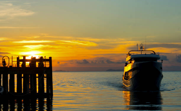 istock SILHOUETTE BOAT SHIP ENTERING DOCK 1193119817