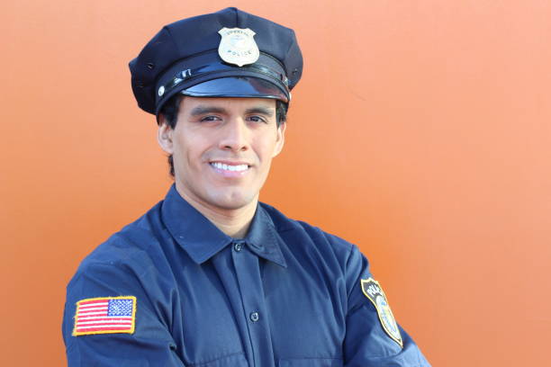 istock American cop in orange background 1193121516