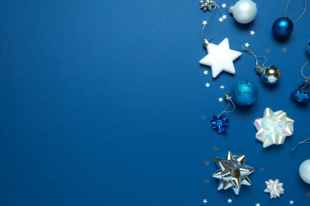 istock Christmas background with decorations and gift boxes on dark blue background 1193121674