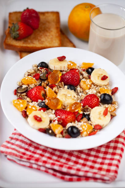 istock Close-up of healthy oats breakfast with various fruit toppings. 1193121821