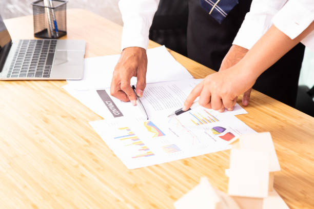 istock Close-up image of interior designers discussing budgets and target for new project. 1193122721