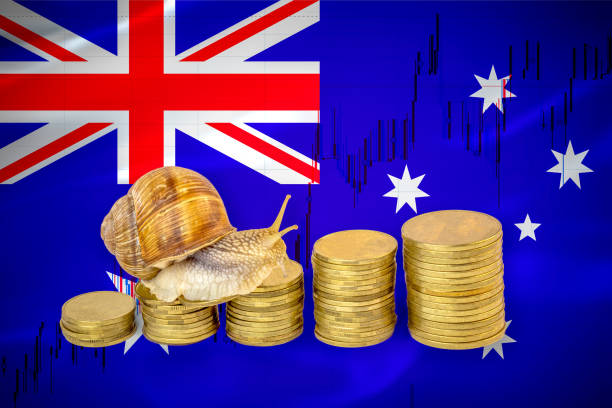 Financial business concept of snail crawling on a pile of coins in front of stock chart and a flag of Australia. Slow economic growth Snail business growth concept Highest Paying Jobs in Australia stock pictures, royalty-free photos & images